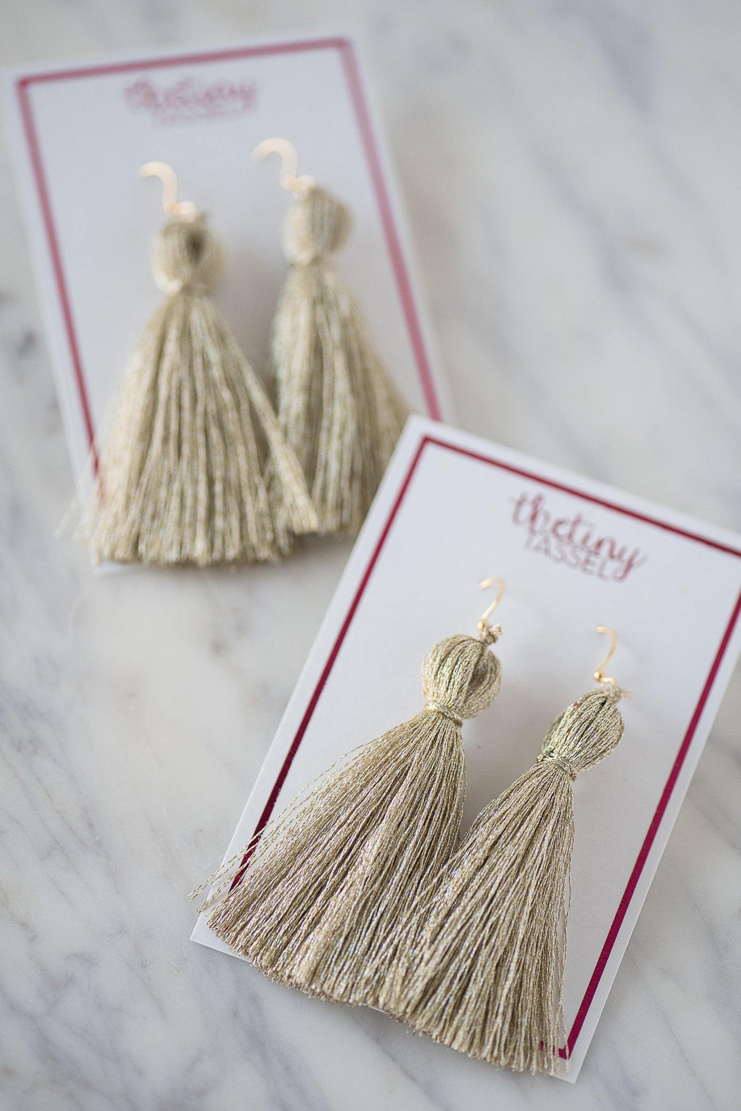 The St. Margaret Tassel Earring in Platinum